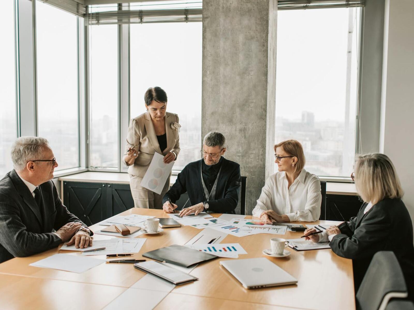 Professional safety consultants in a meeting discussing health and safety compliance